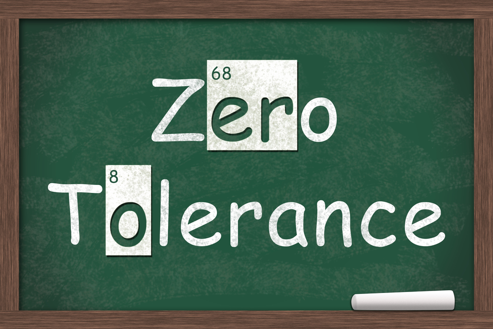 Zero tolerance written on a chalk board