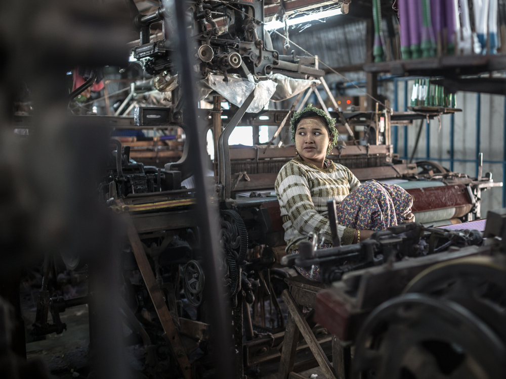 Woman in a factory under slavery conditions