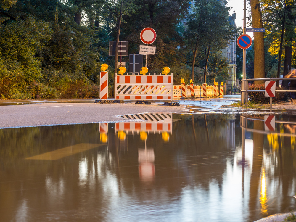 Road closed signs amid flooded water